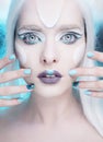 Pretty woman with snow queen makeup and nails closeup.