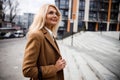 Pretty woman standing near an office building Royalty Free Stock Photo