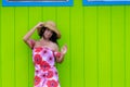 Pretty woman in a straw sunhat in Hawaii