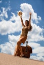 Pretty woman with suitcase and guitar Royalty Free Stock Photo