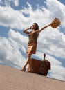 Pretty woman with suitcase and guitar Royalty Free Stock Photo