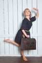 Pretty woman with a suitcase in his hand Royalty Free Stock Photo