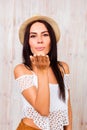 Pretty woman in summer hat sending air kiss Royalty Free Stock Photo