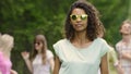 Pretty woman in sunglasses dancing with friends at summer camp, youthfulness