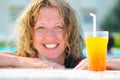 Pretty woman in swimming pool with cocktail Royalty Free Stock Photo