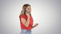 Pretty woman talking on the phone on gradient background. Royalty Free Stock Photo