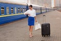 Pretty woman at the train station Royalty Free Stock Photo