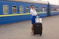 Pretty woman at the train station Royalty Free Stock Photo