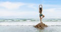 Woman in bikini have standing meditation and yoga in sea in summer Royalty Free Stock Photo