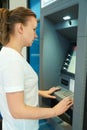Pretty woman using ATM. Royalty Free Stock Photo