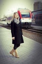 Pretty woman waitting a train