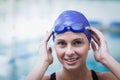 Pretty woman wearing swim cap and goggles Royalty Free Stock Photo