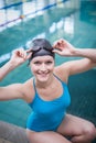 Pretty woman wearing swim cap and swimming goggles Royalty Free Stock Photo