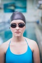 Pretty woman wearing swim cap and swimming goggles Royalty Free Stock Photo