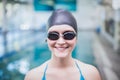 Pretty woman wearing swim cap and swimming goggles Royalty Free Stock Photo