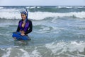 Pretty woman in wetsuit going snorkeling