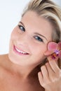 Pretty woman whith pure healthy skin and orchid