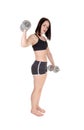 Pretty woman working put whit two dumbbells