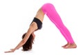 Pretty Woman In Yoga Pose - Downward Facing Dog Position.
