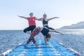 Womans doing yoga exercise on the beach, woman relaxing on the beach, woman doing yoga