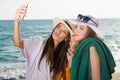 Pretty Women at the Beach Taking Selfie Royalty Free Stock Photo