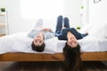 Portrait of a latin woman lying in bed next to her best friend Royalty Free Stock Photo