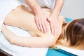 Pretty woman or girl with body and male hands of masseur therapist makes massage in beauty spa salon Royalty Free Stock Photo