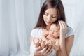 Pretty woman holding a newborn baby in her arms Royalty Free Stock Photo
