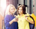 Pretty women with shopping bags outdoors Royalty Free Stock Photo