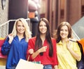 Pretty women with shopping bags posing together Royalty Free Stock Photo