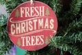 Pretty wood ornament that spells out `Fresh Christmas Trees`