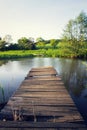 Pretty wooden pier at pond during sunset, colorful summer day, new life change concept, fresh start, new year resolution