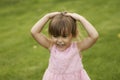 Pretty 3 1/2 year old Asian-Caucasian girl in pink dress