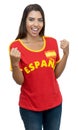 Pretty young adult soccer fan from Spain with red jersey