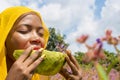 pretty young african lady enjoying a delicious slice of watermelon fruit outside Royalty Free Stock Photo