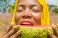 pretty young african woman eating watermelon outside Royalty Free Stock Photo