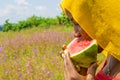 pretty young african woman eating watermelon outside Royalty Free Stock Photo