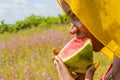 pretty young african woman eating watermelon outside Royalty Free Stock Photo