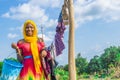 pretty young african woman hanging clothes on a line to dry outside after doing laundry Royalty Free Stock Photo