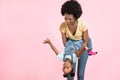 Pretty young African woman have fun with cute child baby girl 3-4 years old. Mommy and her little kid daughter isolated Royalty Free Stock Photo