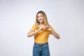 Pretty young asian woman making a heart gesture with her fingers in front of her chest Royalty Free Stock Photo
