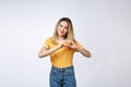 Pretty young asian woman making a heart gesture with her fingers in front of her chest Royalty Free Stock Photo