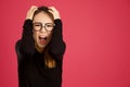 Pretty young asian woman in the studio screaming at camera Royalty Free Stock Photo