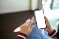 A woman using her smartphone. Phone white screen mockup. close-up image Royalty Free Stock Photo