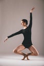 Young ballerina having exercises in the studio