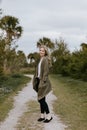 Pretty Young Beauty Woman Model with Gorgeous Long Blond Hair Blowing in the Wind Smiling for Portrait Shots Outside at the Park Royalty Free Stock Photo