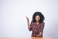 Pretty young black woman looking surprised and feeling excited while using her phone Royalty Free Stock Photo