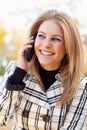 Pretty Young Blond Woman on Phone Outside Royalty Free Stock Photo