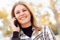 Pretty Young Blond Woman on Phone Outside Royalty Free Stock Photo