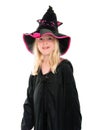 Pretty young blonde girl with missing teeth dressed as a witch for Halloween Royalty Free Stock Photo